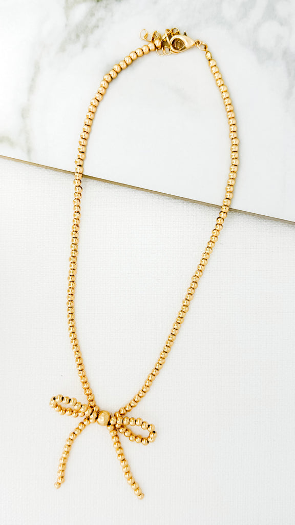 Gold Beaded Bow Necklace
